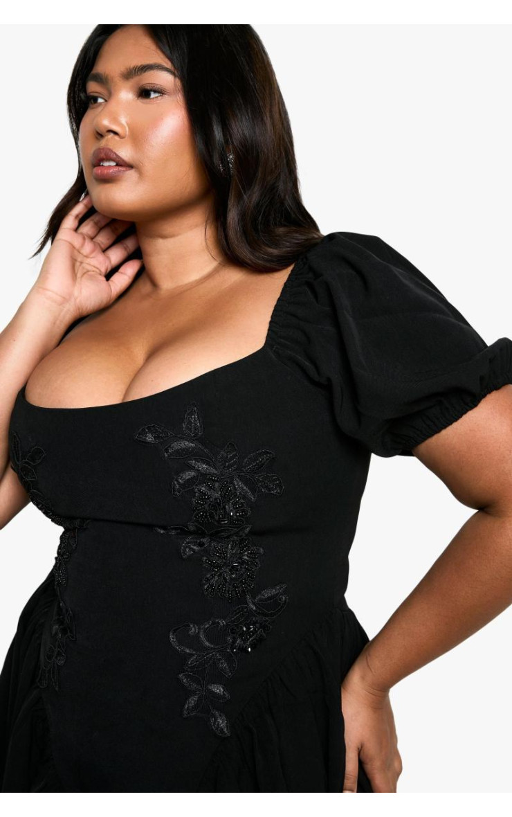 Сукня-комбінезон з пуховими рукавами