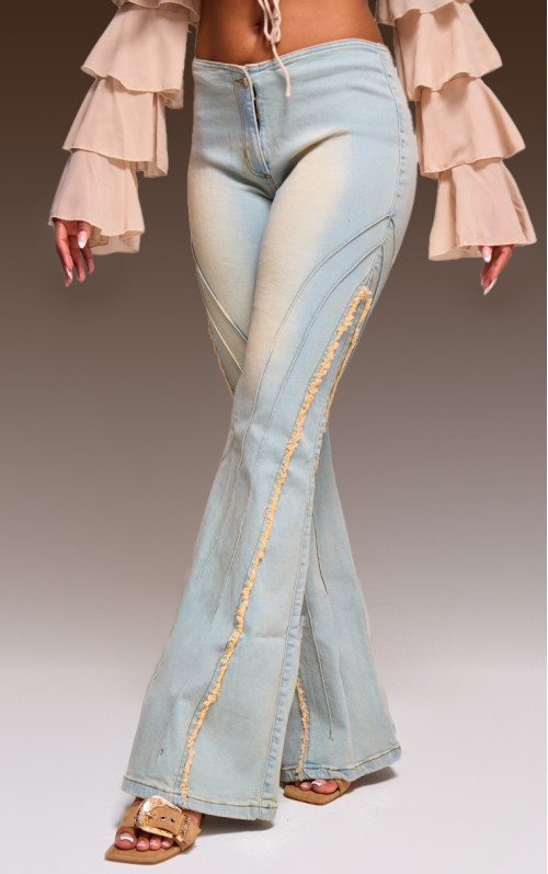 Вінтажні розкльошені джинси зі зношеними швами