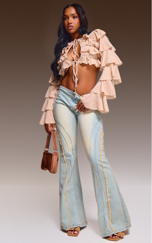 Вінтажні розкльошені джинси зі зношеними швами